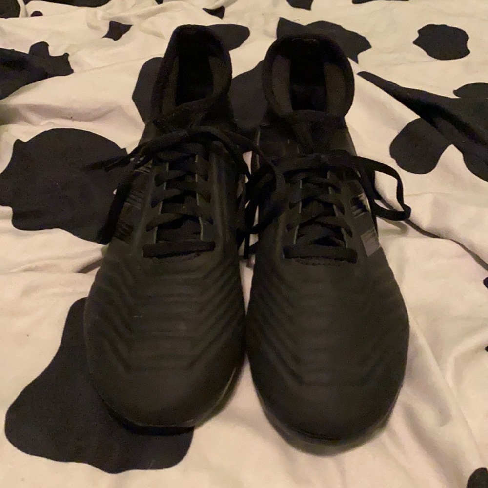 Black predator soccer cleats
